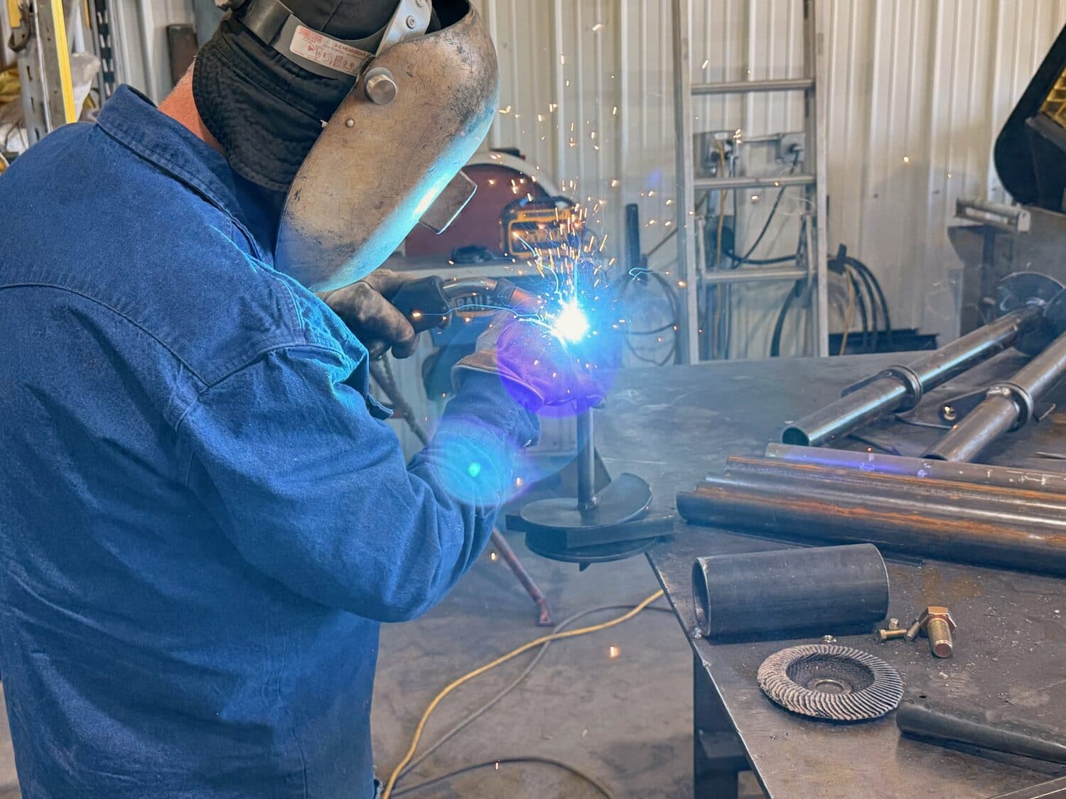 Welding the auger disc to the anchor shaft