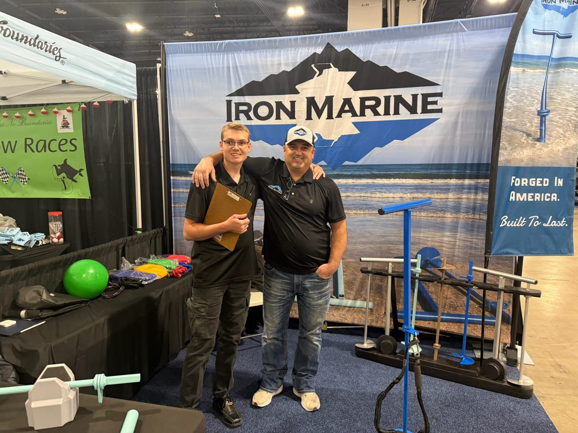 Iron Marine co-founders Lance Nelsen and Wesley Janssen at a boat-show booth